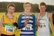 11 December 2011; Ryan Holt, Ulster, winner, with second placed Ian Hartnett, Togher AC, right, and third placed Jake O'Regan, St. Johns AC, Clare, left, after the Boy's U19 race at the Woodie’s DIY Novice and Juvenile Cross Country Championships. Curragh Camp, The Curragh, Co. Kildare. Picture credit: Pat Murphy / SPORTSFILE