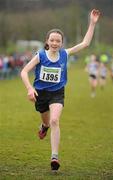 11 December 2011; Caoimhe Harrington, Cork, crosses the finish line to win the Girl's U13 race at the Woodie’s DIY Novice and Juvenile Cross Country Championships. Curragh Camp, The Curragh, Co. Kildare. Picture credit: Pat Murphy / SPORTSFILE
