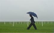 27 May 2017; Jockey Ryan Moore walks the course in heavy rain ahead of the races at Tattersalls Irish Guineas Festival at The Curragh, Co Kildare. Photo by Cody Glenn/Sportsfile