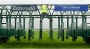 27 May 2017; Adam Talbot prepares the starting gates ahead of the races at Tattersalls Irish Guineas Festival at The Curragh, Co Kildare. Photo by Cody Glenn/Sportsfile