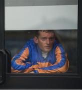 27 May 2017; Jockey Seamie Heffernan looks on from the weigh room during heavy rain before the Tattersalls Irish Guineas Festival at The Curragh, Co Kildare. Photo by Cody Glenn/Sportsfile