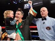 26 May 2017; Michael Conlan celebrates with his daughter Luisne after winning his bout against Alfredo Chanez at the UIC Pavilion in Chicago, USA. Photo by Mikey Williams/Top Rank/Sportsfile