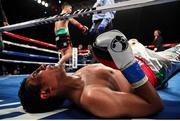 26 May 2017; Alfredo Chanez lies on the matt after being knocked down by Michael Conlan during their bout at the UIC Pavilion in Chicago, USA. Photo by Mikey Williams/Top Rank/Sportsfile