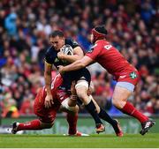 27 May 2017; Tommy O'Donnell of Munster is tackled by Werner Kruger, left, and Ryan Elias of Scarlets during the Guinness PRO12 Final between Munster and Scarlets at the Aviva Stadium in Dublin. Photo by Ramsey Cardy/Sportsfile