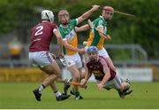27 May 2017; Gary Greville of Westmeath passes to team-mate Conor Shaw despite the efforts of Peter Geraghty and Emmett Nolan of Offaly, right, during the Leinster GAA Hurling Senior Championship Quarter-Final match between Westmeath and Offaly at TEG Cusack Park in Mullingar, Co Westmeath. Photo by Piaras Ó Mídheach/Sportsfile