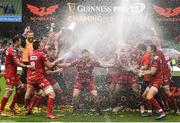 27 May 2017; Scarlets' James Davies is sprayed with champagne by teammates following their victory in the Guinness PRO12 Final between Munster and Scarlets at the Aviva Stadium in Dublin. Photo by Ramsey Cardy/Sportsfile