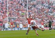 4 September 2005; Peter Canavan, Tyrone, kicks the winning point for victory over Armagh in injury time as Paul McGrane, Armagh, tries to block. Bank of Ireland All-Ireland Senior Football Championship Semi-Final, Armagh v Tyrone, Croke Park, Dublin. Picture credit; David Maher / SPORTSFILE