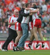 4 September 2005; Peter Canavan, far right, Tyrone, celebrates at the end of the game with supporters after his late point secured victory over Armagh. Bank of Ireland All-Ireland Senior Football Championship Semi-Final, Armagh v Tyrone, Croke Park, Dublin. Picture credit; David Maher / SPORTSFILE