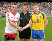 30 July 2011; Tyrone captain Ryan McMenamin, left, and Roscommon captain Peter Domican, right, with referee Maurice Deegan before the game. GAA Football All-Ireland Senior Championship Qualifier, Round 4, Roscommon v Tyrone, Croke Park, Dublin. Picture credit: Ray McManus / SPORTSFILE