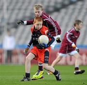 13 December 2011; Fiachra Potts, Scoil Neasáin, Harmonstown, in action against Dylan O'Connell, Holy Child BNS, Whitehall. Allianz Cumann na mBunscol Finals, Corn Cumann na nGael, Scoil Neasáin, Harmonstown v Holy Child BNS, Whitehall, Croke Park, Dublin. Picture credit: Brian Lawless / SPORTSFILE