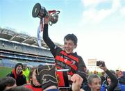 13 December 2011; James Madden, captain, Scoil Cholmcille, Knocklyon, is lifted shoulder high with the cup by his team-mates. Allianz Cumann na mBunscol Finals, Corn Kitterick, Belgrove BNS, Clontarf, v Scoil Cholmcille, Knocklyon, Croke Park, Dublin. Picture credit: Brian Lawless / SPORTSFILE