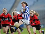 13 December 2011; Aofe Bartun, Gaelscoil Chnoc Liamna, in action against Kate Hutchinson, St. Colmcille's S.N.S, Knocklyon. Allianz Cumann na mBunscol Finals, Corn Irish Rubies, Gaelscoil Chnoc Liamna v St. Colmcille's S.N.S, Knocklyon, Croke Park, Dublin. Picture credit: Brian Lawless / SPORTSFILE