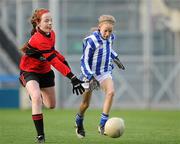 13 December 2011; Hannah Nic Críosta, Gaelscoil Chnoc Liamna, in action against Laura Smithers, St. Colmcille's S.N.S, Knocklyon. Allianz Cumann na mBunscol Finals, Corn Irish Rubies, Gaelscoil Chnoc Liamna v St. Colmcille's S.N.S, Knocklyon, Croke Park, Dublin. Picture credit: Brian Lawless / SPORTSFILE