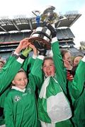 14 December 2011; Éile Ní Chianáin, captain, right, Scoil Naithí, Ballinteer, lifts the cup. Allianz Cumann na mBunscol Finals, Corn Na Laoch, Scoil Naithí, Ballinteer, v Holy Rosary NS, Firhouse, Croke Park, Dublin. Picture credit: Brian Lawless / SPORTSFILE