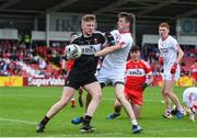 28 May 2017; Oran Hartin of Derry is tackled by PT Cunningham of Tyrone during the Electric Ireland GAA Ulster GAA Football Minor Championship Quarter-Final match between Derry and Tyrone at Celtic Park in Derry. Photo by Ramsey Cardy/Sportsfile