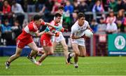 28 May 2017; Darragh Canavan of Tyrone in action against Sean McKeever of Derry during the Electric Ireland GAA Ulster GAA Football Minor Championship Quarter-Final match between Derry and Tyrone at Celtic Park in Derry. Photo by Ramsey Cardy/Sportsfile