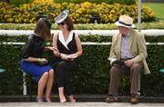 28 May 2017; Sisters Eilis Daly, left, and Siobhán Daly, from Kilkenny City, get a few tips from Robert Moore, from Stamullen, Co Meath, before the Tattersalls Irish Guineas Festival at The Curragh, Co Kildare. Photo by Cody Glenn/Sportsfile