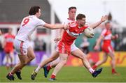 28 May 2017; Enda Lynn of Derry is tackled by Conall McCann, left, and Kieran McGeary of Tyrone during the Ulster GAA Football Senior Championship Quarter-Final match between Derry and Tyrone at Celtic Park in Derry. Photo by Ramsey Cardy/Sportsfile