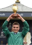 28 May 2017; Jockey Andrea Atzeni celebrates with the Gold Cup after winning the Tattersalls Gold Cup on Decorated Knight at Tattersalls Irish Guineas Festival at The Curragh, Co Kildare. Photo by Cody Glenn/Sportsfile