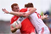 28 May 2017; Conor McAtamney of Derry is tackled by Conor Meyler of Tyrone during the Ulster GAA Football Senior Championship Quarter-Final match between Derry and Tyrone at Celtic Park in Derry. Photo by Ramsey Cardy/Sportsfile