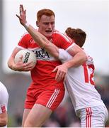 28 May 2017; Conor McAtamney of Derry is tackled by Conor Meyler of Tyrone during the Ulster GAA Football Senior Championship Quarter-Final match between Derry and Tyrone at Celtic Park in Derry. Photo by Ramsey Cardy/Sportsfile