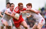 28 May 2017; Conor McAtamney of Derry is tackled by Colm Cavanagh, left, and Conor Meyler of Tyrone during the Ulster GAA Football Senior Championship Quarter-Final match between Derry and Tyrone at Celtic Park in Derry. Photo by Ramsey Cardy/Sportsfile