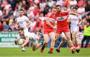 28 May 2017; Niall Sludden of Tyrone is tackled by Conor McAtamney of Derry during the Ulster GAA Football Senior Championship Quarter-Final match between Derry and Tyrone at Celtic Park in Derry. Photo by Ramsey Cardy/Sportsfile