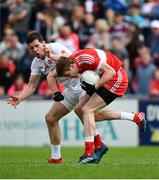 28 May 2017; Brendan Rogers of Derry is tackled by Sean Cavanagh of Tyrone during the Ulster GAA Football Senior Championship Quarter-Final match between Derry and Tyrone at Celtic Park in Derry. Photo by Ramsey Cardy/Sportsfile