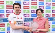 28 May 2017; Conall McCann of Tyrone is presented with the man of the match award by Michaela Dowd, Operations Manager, Eir, following the Ulster GAA Football Senior Championship Quarter-Final match between Derry and Tyrone at Celtic Park in Derry. Photo by Ramsey Cardy/Sportsfile