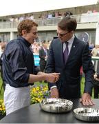 28 May 2017; Trainer Aidan O'Brien in conversation with Jockey Ryan Moore after sending out Winter to win Tattersalls Irish 1,000 Guineas at Tattersalls Irish Guineas Festival at The Curragh, Co Kildare. Photo by Cody Glenn/Sportsfile