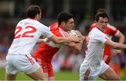 28 May 2017; Danny Heavron of Derry in action against Ronan McNabb , left, and Aidan McCrory of Tyrone during the Ulster GAA Football Senior Championship Quarter-Final match between Derry and Tyrone at Celtic Park, in Derry. Photo by Oliver McVeigh/Sportsfile