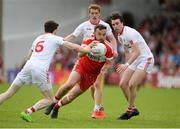 28 May 2017; Emmett McGuckin of Derry in action against, from left, Rory Brennan, Peter Harte and Conall McCann of Tyrone during the Ulster GAA Football Senior Championship Quarter-Final match between Derry and Tyrone at Celtic Park, in Derry. Photo by Oliver McVeigh/Sportsfile