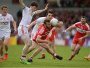 28 May 2017; Emmett McGuckin of Derry in action against Rory Brennan, left, and Conall McCann of Tyrone during the Ulster GAA Football Senior Championship Quarter-Final match between Derry and Tyrone at Celtic Park, in Derry.  Photo by Oliver McVeigh/Sportsfile