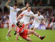 28 May 2017; Emmett McGuckin of Derry in action against Rory Brennan, left, and Conall McCann of Tyrone during the Ulster GAA Football Senior Championship Quarter-Final match between Derry and Tyrone at Celtic Park, in Derry. Photo by Oliver McVeigh/Sportsfile