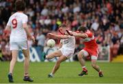 28 May 2017; Niall Sludden of Tyrone  in action against Benny Heron of Derry during the Ulster GAA Football Senior Championship Quarter-Final match between Derry and Tyrone at Celtic Park, in Derry.  Photo by Oliver McVeigh/Sportsfile