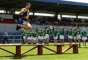 28 May 2017; Gary Brennan of Clare jumps over the team bench ahead of the Munster GAA Football Senior Championship Quarter-Final between Clare and Limerick at Cusack Park in Ennis, Co. Clare. Photo by Diarmuid Greene/Sportsfile