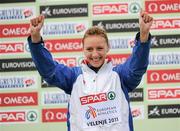 11 December 2011; Ioana Doaga, Romania, on the podium after finishing second during the Junior Women's event at the 18th SPAR European Cross Country Championships 2011. Velenje, Slovenia. Picture credit: Stephen McCarthy / SPORTSFILE