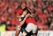 18 December 2011; Liam Williams, Scarlets, tackled by Simon Zebo, left, and Keith Earls, Munster. Heineken Cup, Pool 1, Round 4, Munster v Scarlets, Thomond Park, Limerick. Picture credit: Stephen McCarthy / SPORTSFILE