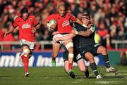 18 December 2011; Simon Zebo, Munster, tackled by Matthew Rees, left, and Rhys Thomas, Scarlets. Heineken Cup, Pool 1, Round 4, Munster v Scarlets, Thomond Park, Limerick. Picture credit: Stephen McCarthy / SPORTSFILE