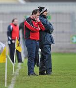 18 December 2011; St Brigid's managers Mark Byrne, left, and Gerry McEntee during the closing stages of the game. AIB Leinster GAA Football Senior Club Championship Final, St Brigid's, Dublin v Garrycastle, Westmeath, O'Connor Park, Tullamore, Co. Offaly. Picture credit: David Maher / SPORTSFILE