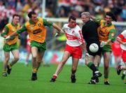 19 July 1998. Derry's Eamonn Burns in a race for possession with Donegal's Noel Hegarty, left, and Jim McGuinness and Referee Jim Curran. Ulster Football Final, Derry v Donegal, Clones. Picture Credit Matt Browne/SPORTSFILE