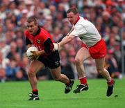 File Pic: James McCartan ( Down ) gets away from Tyrone's Chris Lawn during the 1996 Ulster Final in Clones. Photograph: David Maher SPORTSFILE.