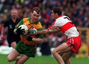 19 July 1998. Tony Boyle Donegal in action against Sean Martin Lockhart Derry. Ulster Football Final, Derry v Donegal, Clones. Picture Credit Matt Browne/SPORTSFILE