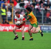 19 July 1998. Derry's Dermot Dougan in a tussle for possession with Donegal's Jim McGuinness. Ulster Football Final, Derry v Donegal, Clones. Picture Credit Matt Browne/SPORTSFILE
