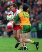 19 July 1998: Kieran McKeever, Derry Captain is tackled by Brendan Devenney Donegal. Ulster Football Final Derry v Donegal at St. Tighearnach's Park Clones. Picture Credit Matt Browne SPORTSFILE.