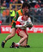 19 July 1998. Derry's Paul McFlynn is tackled by John Duffy, Donegal. Ulster Football Final, Derry v Donegal, Clones. Picture Credit Matt Browne/SPORTSFILE
