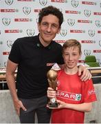 31 May 2017; SPAR FAI Primary School 5s Programme ambassador and former Republic of Ireland International Keith Andrews presents the Player of the Tournament trophy to Paudie Murphy, from Granagh NS, Limerick, during the SPAR FAI Primary School 5s National Finals at Aviva Stadium where girls and boys from 12 counties battled it out for national honours. The 2017 SPAR FAI Primary School 5s Programme was the biggest yet as almost 28,576 children from 1,495 schools took part in county, regional and provincial blitzes nationwide. For further information please see www.spar.ie or www.faischools.ie Photo by Cody Glenn/Sportsfile