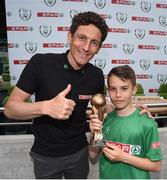 31 May 2017; SPAR FAI Primary School 5s Programme ambassador and former Republic of Ireland International Keith Andrews presents the Player of the Tournament Section B trophy to Michael Lavin, from Scoil Mhuire Gan Smal, Co Sligo, during the SPAR FAI Primary School 5s National Finals at Aviva Stadium where girls and boys from 12 counties battled it out for national honours. The 2017 SPAR FAI Primary School 5s Programme was the biggest yet as almost 28,576 children from 1,495 schools took part in county, regional and provincial blitzes nationwide. For further information please see www.spar.ie or www.faischools.ie Photo by Cody Glenn/Sportsfile