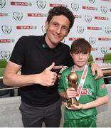 31 May 2017; SPAR FAI Primary School 5s Programme ambassador and former Republic of Ireland International Keith Andrews presents the Player of the Tournament Section C trophy to Matthew Thompson, from Scoil Iognáid, Co Galway, during the SPAR FAI Primary School 5s National Finals at Aviva Stadium where girls and boys from 12 counties battled it out for national honours. The 2017 SPAR FAI Primary School 5s Programme was the biggest yet as almost 28,576 children from 1,495 schools took part in county, regional and provincial blitzes nationwide. For further information please see www.spar.ie or www.faischools.ie Photo by Cody Glenn/Sportsfile