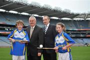20 December 2011; Uachtarán Chumann Lúthchleas Gael Criostóir Ó Cuana, second from left, and Jim Geraghty, Senior Brand Manager, Lucozade Sport, with youth players, Barry Neville, age 14, left, and Clare Nulty, age 13, from Castleknock GAA Club, in attendance at the GAA Games Development Conference  Launch. The Conference will take place on January 14th 2012 in Croke Park. Following on from the success of the 2010 Conference- which focused on issues related to the development of the child layer - the 2011 Conference will focus on issues related to the Youth Player (aged 13 - 18 years). Croke Park, Dublin. Picture credit: Brian Lawless / SPORTSFILE